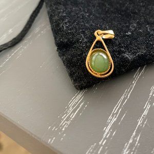 jade and gold pendant